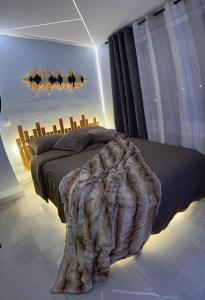 Ένα ή περισσότερα κρεβάτια σε δωμάτιο στο Luxueux appartement love avec Sauna