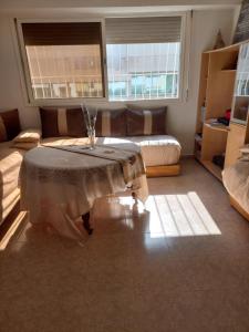 a living room with a table and a couch at STAR APPARTEMENT GAUTHIER in Casablanca +11 photos