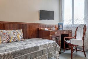 TV a/nebo společenská místnost v ubytování Vintage Hotel Tornese - Business & Events