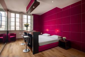 Postel nebo postele na pokoji v ubytování UNA HOTELS Vittoria Firenze