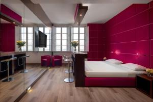 Postel nebo postele na pokoji v ubytování UNA HOTELS Vittoria Firenze