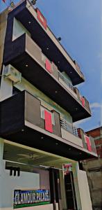 a building with balconies on the side of it at Glamour Palace in Bodh Gaya