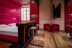 Postel nebo postele na pokoji v ubytování UNA HOTELS Vittoria Firenze
