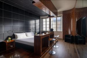 Postel nebo postele na pokoji v ubytování UNA HOTELS Vittoria Firenze + 37 fotografií