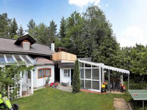 a house with a conservatory and a yard at Holiday home in Wernberg with pool and sauna in Wernberg