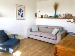 a living room with a couch and a chair at Perfect for couples+children / baby friendly /50m² in Paris