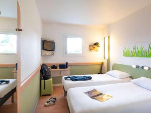 Posteľ alebo postele v izbe v ubytovaní ibis budget Krakow Stare Miasto
