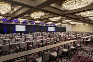 a large room with rows of chairs and chandeliers at Hyatt Regency Savannah in Savannah