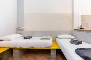 A bed or beds in a room at Loft 33