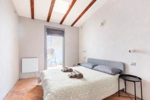 A bed or beds in a room at Loft 33