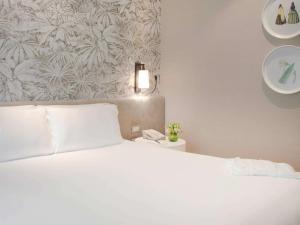 Postel nebo postele na pokoji v ubytování Manto Hotel Lima - MGallery Collection