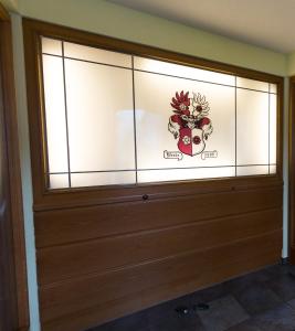 a glass door with a skull sticker on it at Landgasthof Schützen in Tengen