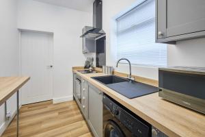 a kitchen with a sink and a dishwasher at Host & Stay - Norton House in Norton