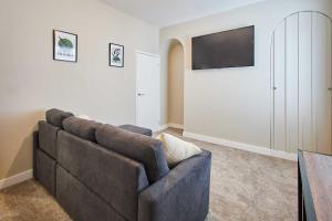 a living room with a couch and a flat screen tv at Host & Stay - Norton House in Norton
