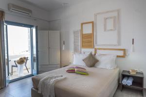 Postel nebo postele na pokoji v ubytování Caldera Romantica Hotel