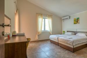 Postel nebo postele na pokoji v ubytování Vila Bronhi