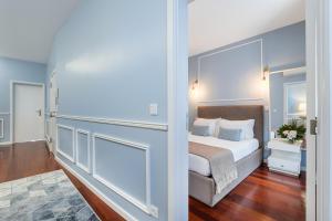 a bedroom with a king sized bed and a mirror at Victoria Project - Apartments - Private Parking in Porto