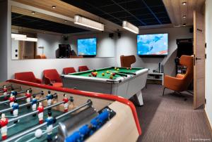 a conference room with a pool table and chairs at Résidence Arpoza - Chalets pour 15 Personnes 094 in Arc 1800
