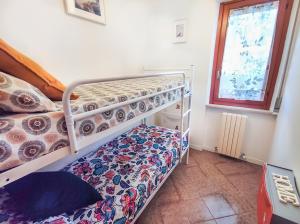 Letto o letti in una camera di Trilocale Volta in seconda fila mare
