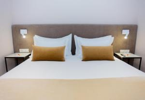 a bedroom with a large bed with two night stands at Gray Hotel Casablanca in Casablanca
