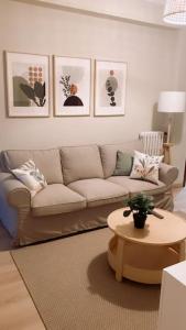 a living room with a couch and a table at BilboAppartment in Bilbao