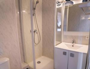 a bathroom with a shower and a sink at Résidence Le 1650 - Studio 964 in Les Orres