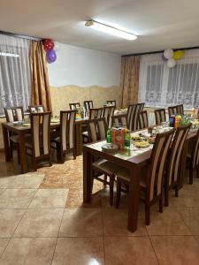 a dining room with tables and chairs and balloons at Agroturystyka u Czepiela in Ochotnica Górna