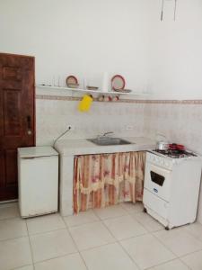 a kitchen with a sink and a stove at Coronado coronado in Playa Coronado