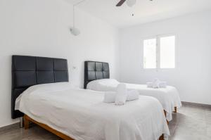 Posteľ alebo postele v izbe v ubytovaní Acapulco Apartments