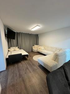 a living room with two beds and a couch at Apartment in Bonn