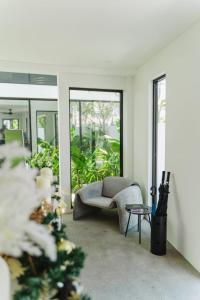 a living room with a couch and a table at Deluxe apartments Canggu area with gym coworking security parking and full services in Tumbak Bayuh