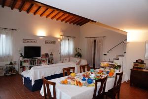 a living room with two tables with food on them at Casalina B & B in Portoferraio