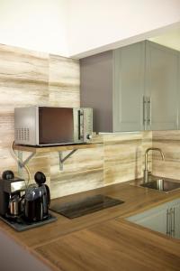 Η κουζίνα ή μικρή κουζίνα στο Hürkecz Apartmanház