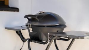 a black pot sitting on top of a grill at Eva Apartments - Patscherkofel in Innsbruck
