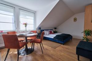 a bedroom with a bed and a table and chairs at Animal Planet by STN in Budapest