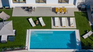 an overhead view of a swimming pool in a yard at Villa Sunset Split overviewing Split and Podstrana bay in Strožanac