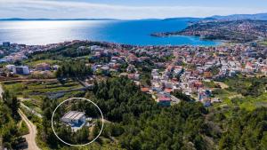 an aerial view of a town next to the water at Villa Sunset Split overviewing Split and Podstrana bay in Strožanac