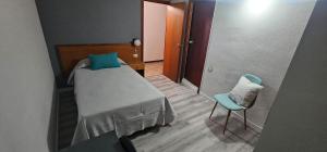 Postel nebo postele na pokoji v ubytování Pensión España 2 Estrellas Cehegin