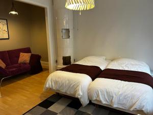 Posteľ alebo postele v izbe v ubytovaní Metropolitan Haven in Stockholm City! 911