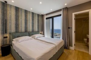 Postel nebo postele na pokoji v ubytování Villa Mare Pelješac + 36 fotografií