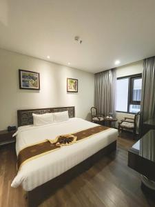 Voodi või voodid majutusasutuse Danaciti Hotel toas