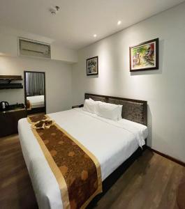 Voodi või voodid majutusasutuse Danaciti Hotel toas