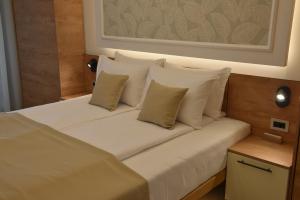 Voodi või voodid majutusasutuse Hotel Zeleni Grad toas