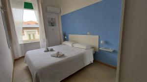 Postel nebo postele na pokoji v ubytování Hotel Canarco