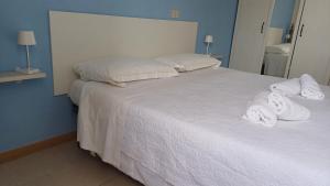 Postel nebo postele na pokoji v ubytování Hotel Canarco