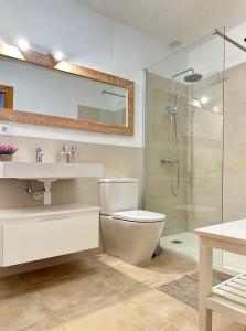 a bathroom with a toilet and a sink and a shower at Duplex Son Parc Best Sea Views in Son Parc