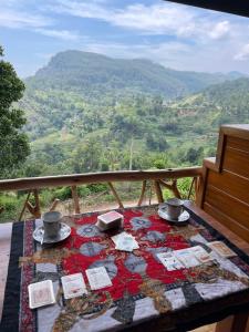 a table with a table cloth on it with a view at The Dream Inn in Ella