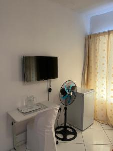 TV a/nebo společenská místnost v ubytování Sunset Guesthouse - Mthatha
