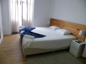 Postel nebo postele na pokoji v ubytování Lagoa Hostel & Suites