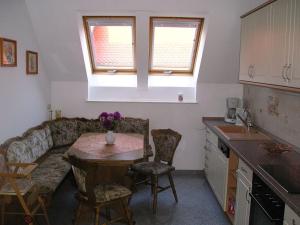 a kitchen with a couch and a table in a kitchen at Sachon Modern Retreat in Dürrwicknitz